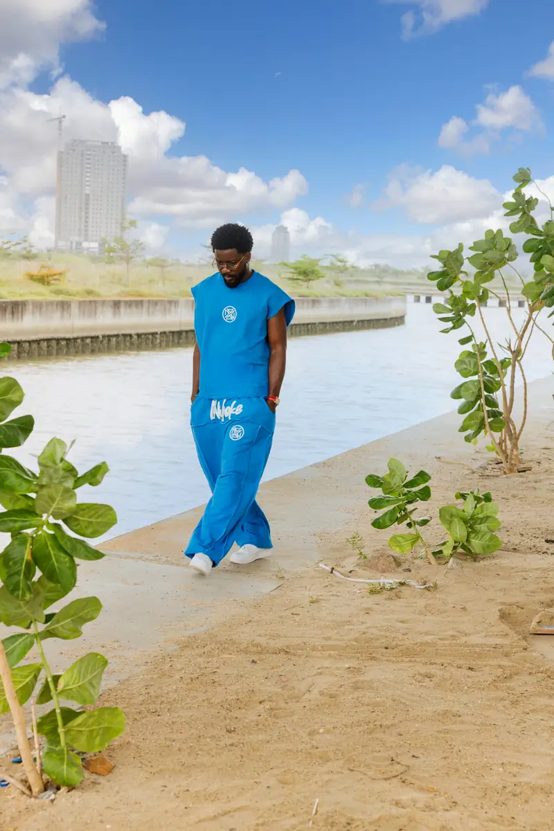 A man in the Cobalt set walking by the canal