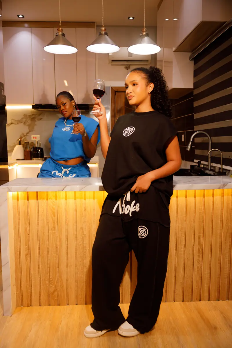 A woman in the Black set in the kitchen