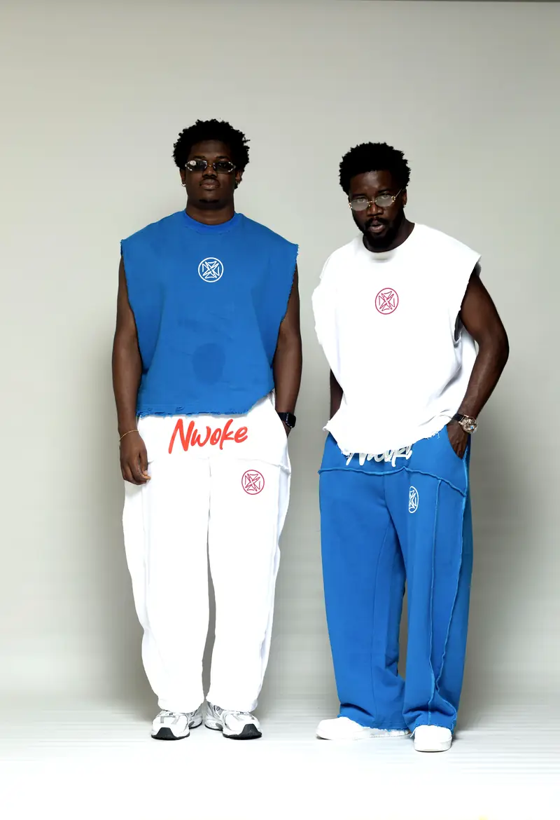 Two men swapping colours: Cobalt top with Bone trouser, Bone top with Cobalt trouser